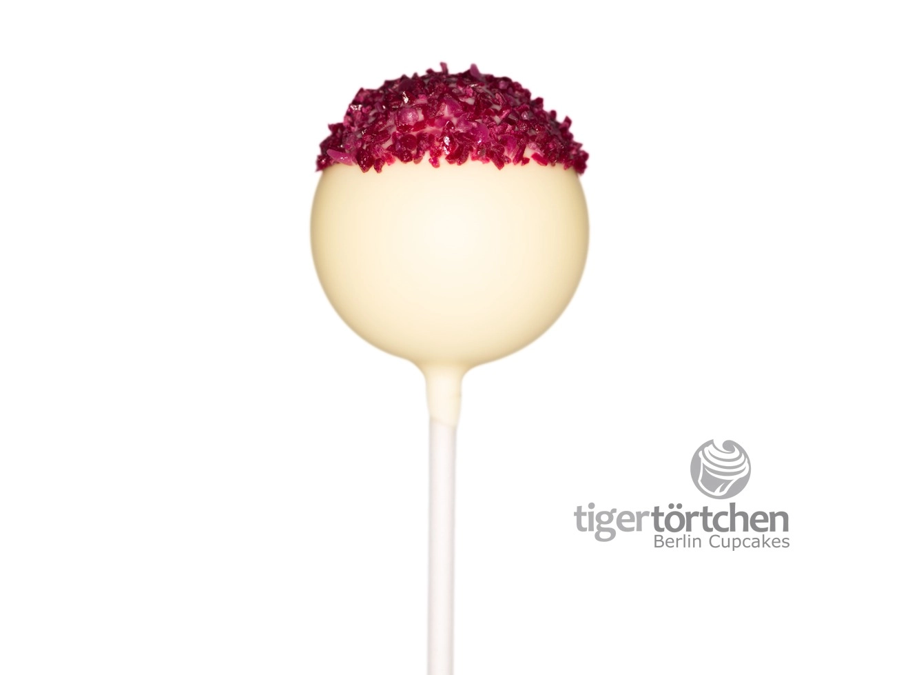 Kokos-Cassis Cake-Pop Kokos-Cassis Cake-Pop: Kokoskuchen mit weißer Schokoladenhülle und Cassis